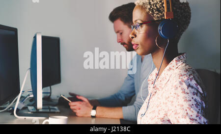 Female software developer working for IT company as programmer Stock Photo