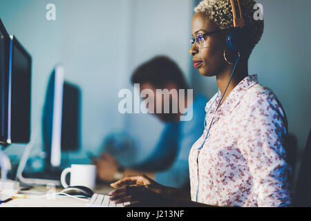 Female software developer working for IT company as programmer Stock Photo