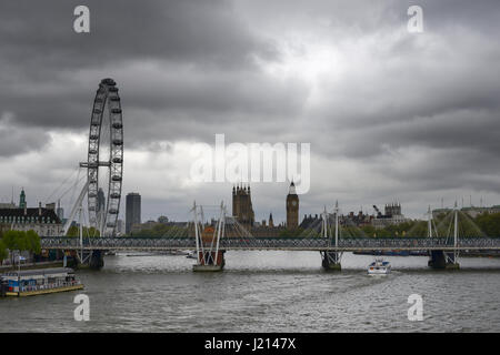 Dark clouds over the Houses of Parliament and London Eye in London Stock Photo