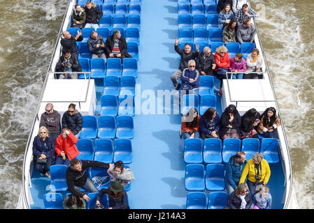 Tourists on a pleasure cruising tour along the River Thames, London UK Stock Photo