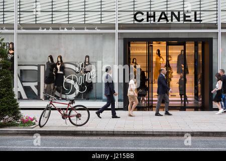 TOKYO, Japan - 24th June 2016: Shoppers pass by the French couture store Chanel in the expensive shopping district of Ginza. Stock Photo