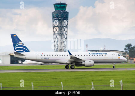 A Copa Airlines Colombia Embraer E190AR accelerates down the runway at El Dorado International Airport, Bogotá, Colombia Stock Photo