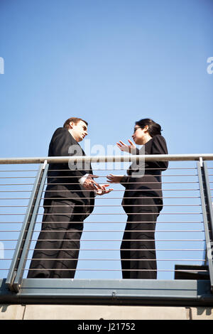 A shot of two business colleagues having a discussion outdoor Stock Photo