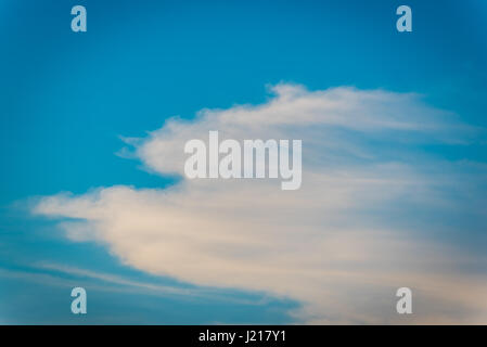 Colorful clouds against blue sky Stock Photo