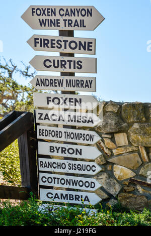 A list of Vineyards' Names on a tall directional sign with arrows directing to Foxen Canyon Wine trail, near Los Olivos, CA in the Santa Ynez Valley Stock Photo