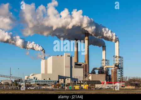 ROTTERDAM, THE NETHERLANDS - NOVEMBER 28, 2016: The Uniper coal power plant in full operation with smoking chimneys at the Maasvlakte near Rotterdam i Stock Photo