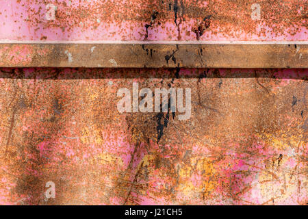 detail image of the side of a multi colored metal trash dumpster in Bath England, UK Stock Photo