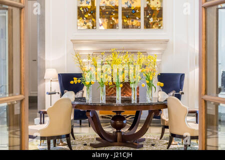 fantastic hotel lobby in London with fresh cut flowers and expensive furniture, London, England Stock Photo