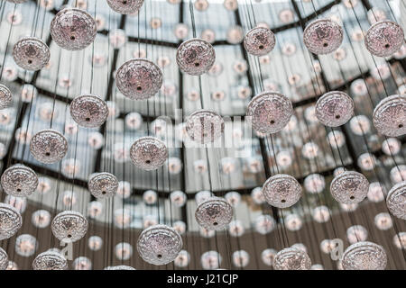 hundreds of small lights hanging from the ceiling Stock Photo