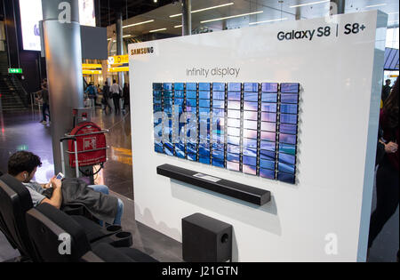 Amsterdam, Netherlands. 21st Apr, 2017. Advertisement for the Samsung Galaxy S8  smartphone, photographed at the Schiphol airport near Amsterdam, Netherlands, 21 April 2017. 100 mobile phones create a screen which displays a movie. Photo: Friso Gentsch/dpa/Alamy Live News Stock Photo