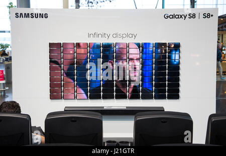 Amsterdam, Netherlands. 21st Apr, 2017. Advertisement for the Samsung Galaxy S8  smartphone, photographed at the Schiphol airport near Amsterdam, Netherlands, 21 April 2017. 100 mobile phones create a screen which displays a movie. Photo: Friso Gentsch/dpa/Alamy Live News Stock Photo