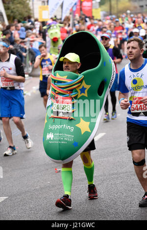 Fun runners in the 2017 London Marathon. The masses of fun runners raise vast sums for charity, often wearing fancy costumes Stock Photo