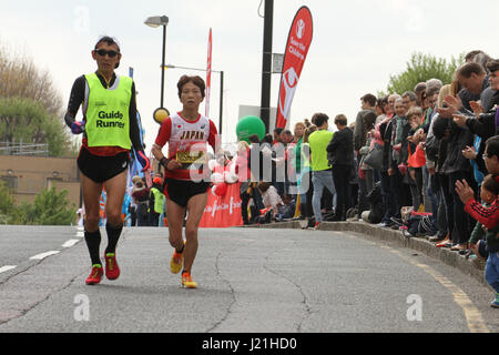 London, UK. 23rd Apr, 2017.  Runners race past the 17 mile mark at Madchutte during the 37th London Marathon on April 22, 2017. Around 40,000 are expected to start the 26.2 miles run from Greenwich to Westminster. Credit: David Mbiyu/Alamy Live News Stock Photo