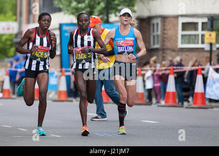 London, UK. 23rd April, 2017. Kellyn Taylor of the United States, who finished 13th in the women's event, runs through Shadwell close to the halfway point of the 2017 Virgin Money London Marathon. Credit: Mark Kerrison/Alamy Live News