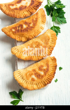 Homemade deep fried vegetable samosas (patties, burekas) - vegetarian fried pastries for snack Stock Photo