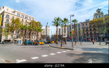 Barcelona, Spain, Nov 3rd, 2013:   Tourism in Europe.  Street level view of pleasant day in Barcelona sunny afternoon, people outdoors on warm day. Stock Photo