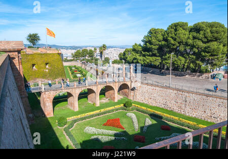 Barcelona, Spain, Nov 3rd, 2013:   People visit old fort Montjuïc Castle in Barcelona.  16th century military fortress atop a hill near Balearic sea. Stock Photo