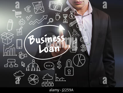 Business, Technology, Internet and network concept. Business man working on the tablet of the future, select on the virtual display: business loan Stock Photo