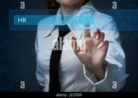Business, technology, internet and networking concept. Business woman presses a button on the virtual screen: HR Stock Photo