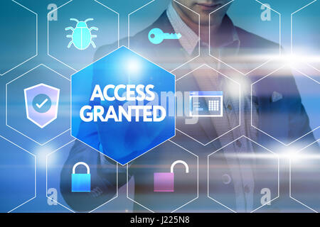 Business, technology, internet and networking concept. Businessman presses a button on the virtual screen: Access granted Stock Photo