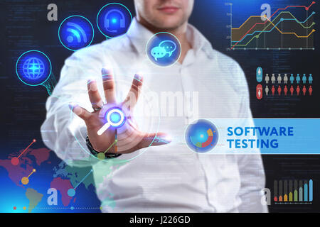 Business, Technology, Internet and network concept. Business man working on the tablet of the future, select on the virtual display: Software testing Stock Photo