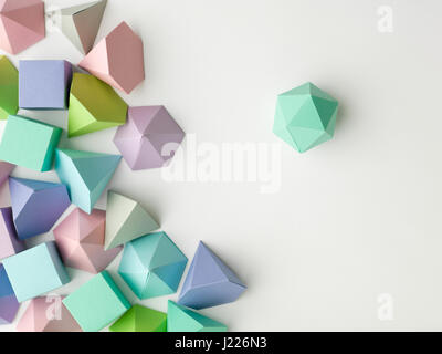 Colorful abstract geometrical composition. Three-dimensional prism pyramid rectangular cube, dodecahedron on white paper background. Geometry models Stock Photo