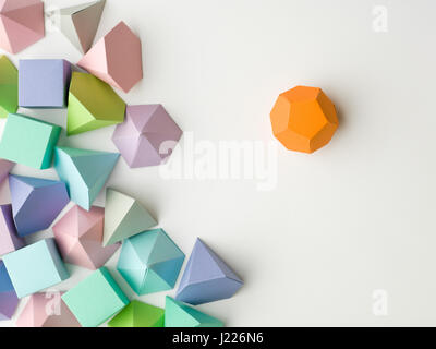 Colorful abstract geometric background with three-dimensional solid figures. Pyramid Dodecahedron prism rectangular cube arranged on white paper. Stock Photo