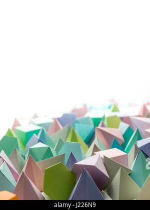 Colorful abstract geometric background with three-dimensional solid figures. Pyramid Dodecahedron prism rectangular cube arranged on white paper. Stock Photo