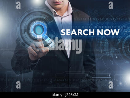 Business, Technology, Internet and network concept. Business man working on the tablet of the future, select on the virtual display: search now Stock Photo