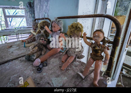 Toys in 'Cheburashka' kindergarten No 10 in Pripyat ghost city, Chernobyl Nuclear Power Plant Zone of Alienation in Ukraine Stock Photo