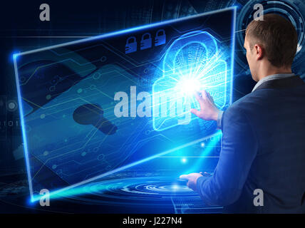 Businessman pressing high tech type of modern buttons on a virtual background Stock Photo