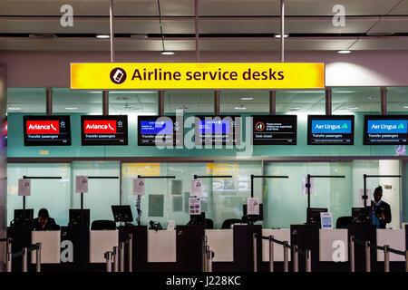London, UK - December 24, 2016 - Airline services desks for transfer passengers at Heathrow Airport Stock Photo