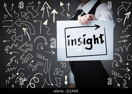 Technology, internet, business and marketing. Young business woman writing word: insight Stock Photo