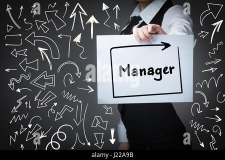 Technology, internet, business and marketing. Young business woman writing word: manager Stock Photo