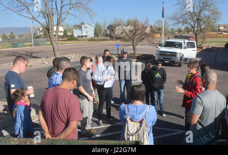 SCHREIVER AIR FORCE BASE, Colo. -- Sally Broomfield, Disaster Program Manager for Southeastern Colorado's American Red Cross, instructs 310th Space Wing volunteers on how to install fire alarms for families in the Cimarron Hills community during a Home Fire Campaign event on Saturday, Apr. 15th, 2017. The Red Cross responds to approximately 64,000 disasters each year with the vast majority being home fires, resulting in a goal to reduce fire-related deaths and injuries. (U.S. Air Force photo/Senior Airman Laura Turner) Stock Photo