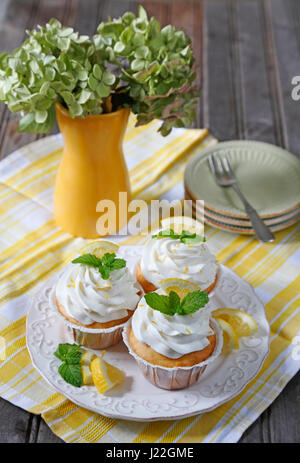 Cupcakes. Lemon cupcakes on old wood table Stock Photo