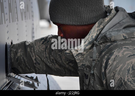 U.S. Air National Guard member Tech. Sgt. Kye Dudley from the 146th Maintenance Squadron inspects the landing gear of a C-130J aircraft at Gowen Field, Idaho, April 20, 2017. Sgt. Dudley and a maintenance crew from the 146th Airlift Wing will be providing maintenance service on two C-130J aircraft equipped with the Modular Airborne Fire Fighting System (MAFFS) from the Channel Islands Air National Guard Station during the week-long multi-agency wildfire training with the U.S. Forest Service, CAL FIRE, and multiple Air National Guard and U.S. Air Force Reserve wings. (U.S. Air National Guard ph Stock Photo