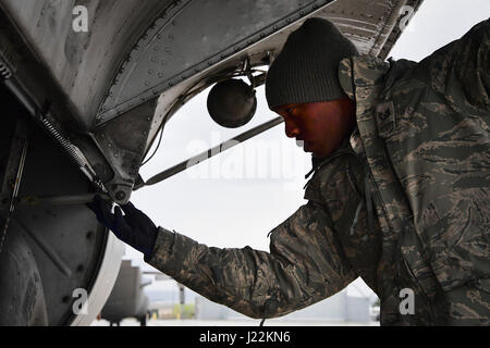 U.S. Air National Guard member Tech. Sgt. Kye Dudley from the 146th Maintenance Squadron inspects the landing gear of a C-130J aircraft at Gowen Field, Idaho, April 20, 2017. Sgt. Dudley and a maintenance crew from the 146th Airlift Wing will be providing maintenance service on two C-130J aircraft equipped with the Modular Airborne Fire Fighting System (MAFFS) from the Channel Islands Air National Guard Station during the week-long multi-agency wildfire training with the U.S. Forest Service, CAL FIRE, and multiple Air National Guard and U.S. Air Force Reserve wings. (U.S. Air National Guard ph Stock Photo