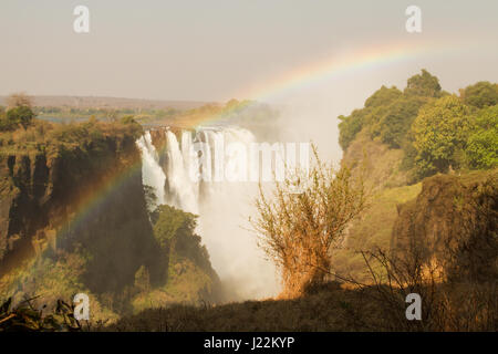 Victoria Falls with rainbow in Zimbabwe, Africa Stock Photo