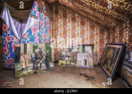 EERIE images reveal incredible art work rediscovered in an abandoned 1960s house frozen in time throughout the years. Other pictures show the intact state of the time capsule house from a dining room filled with a mix of portrait and landscape painting to an untouched lounge, a dimly-lit bedroom with carefully composed painting spread all over, and a loft used to store even more paintings. Captured in Belgium on the borders of Germany by urban explorer, Frank Mirgel (43), on a Canon EOS 600D with 10mm – 18mm wide-angle lens, these photographs display what is believed to be the former home of a Stock Photo
