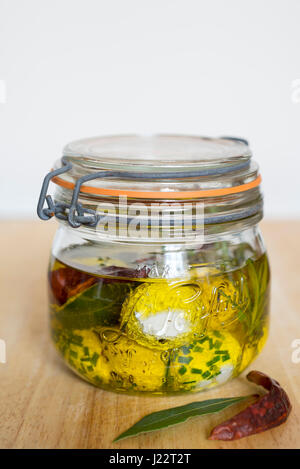 Labneh - freshly made yoghurt cheese, marinated in extra virgin olive oil, herbs and spices. Stock Photo