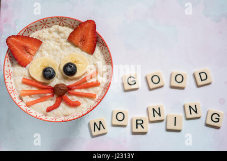 Oatmeal porridge with a kitten face decoration Stock Photo