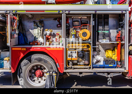 Brakne Hoby, Sweden - April 22, 2017: Documentary of public fire truck presentation. Lots of firefighting equipment visible inside the open truck. Stock Photo