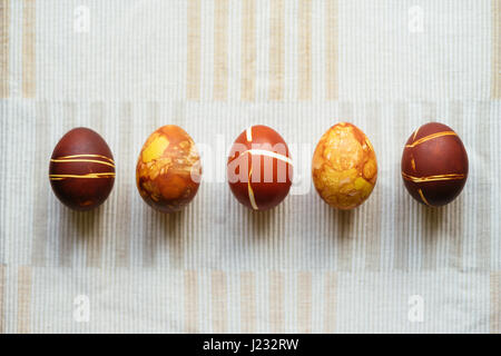 Five decorated Easter eggs, unusual home made painting with onion skins Stock Photo