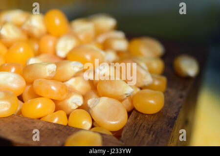 Close-up shoot of corn beans in a wooden chest in natural light. Stock Photo