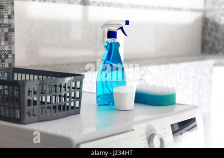 part of washing machine and laundry powder for washing day Stock Photo
