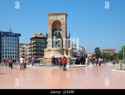 ISTANBUL, TURKEY - JULY 13, 2014: Monument of Republic on Taksim Square commemorate the formation of the Turkish Republic. It portrays the founders of Stock Photo