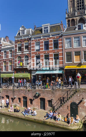 People enjoying the sun at the canals of Utrecht, Holland Stock Photo