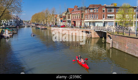 Tourists in a canoe in the historic canals of Utrecht, Holland Stock Photo