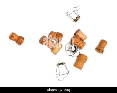Corks from champagne wine and muselets. Isolated on white background with copyspace. View from above. Stock Photo